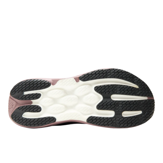 Bottom sole of A New Balance running shoe in a dusty mauve and burgundy colorway, featuring a thick, cushioned pinkish-brown sole and a dark gray 'N' logo on the side, shown against a plain white background.
