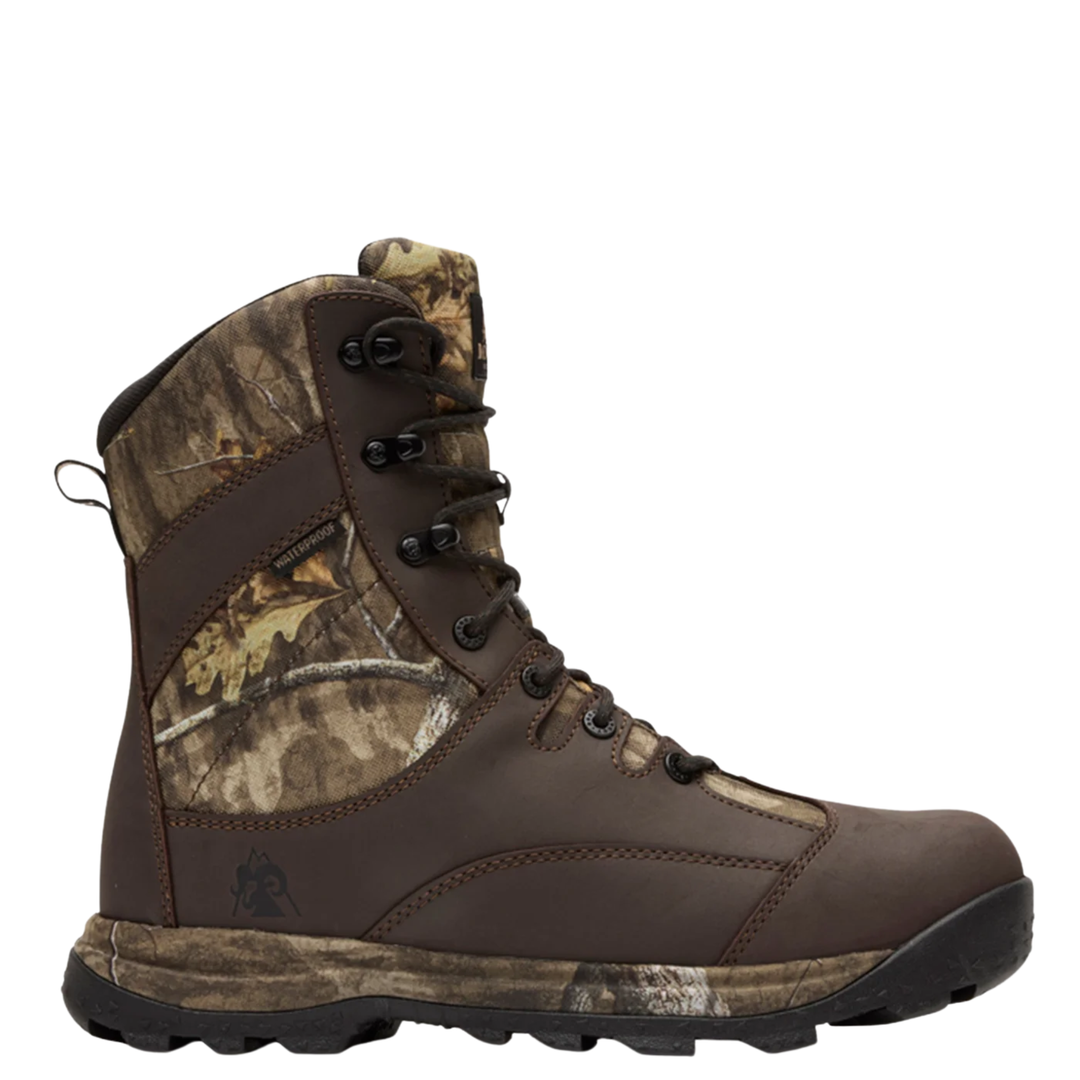 A brown lace-up hunting boot with camouflage panels on the collar and side, shown from a profile view against a white background.