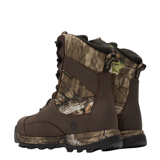 A pair of Kryptek mid-calf hunting boots in brown and woodland camouflage, featuring lace-up front, padded collar, and rugged sole.