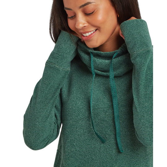 A woman wearing a heathered green cowl-neck pullover hoodie with matching drawstrings, shown from the chest up against a plain white background.