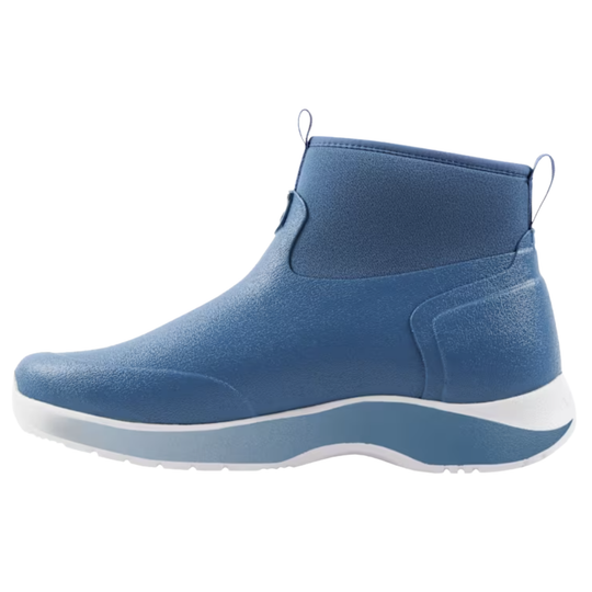 A blue ankle-high slip-on boot with a textured upper, elastic side panel, and a thick white and blue sole, shown from a side profile on a white background.