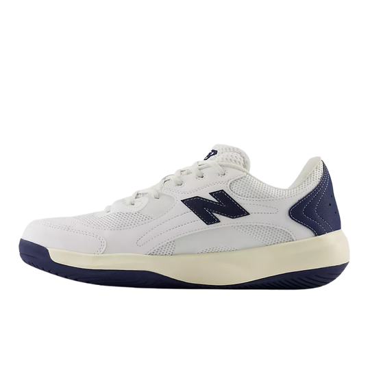 A New Balance athletic shoe in white and navy blue, shown from a side profile view against a plain white background.