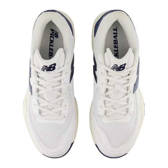 A New Balance athletic shoe in white and navy blue, shown from a top profile view against a plain white background.