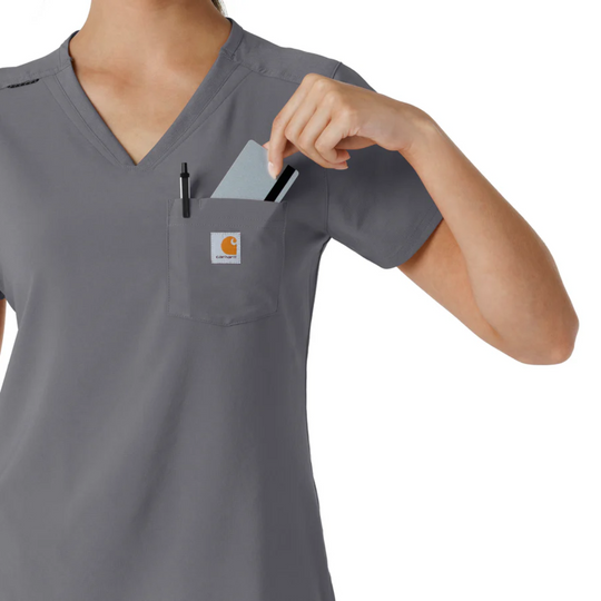 Gray V-neck scrub top with chest pocket, pen, and ID card tucked in the pocket