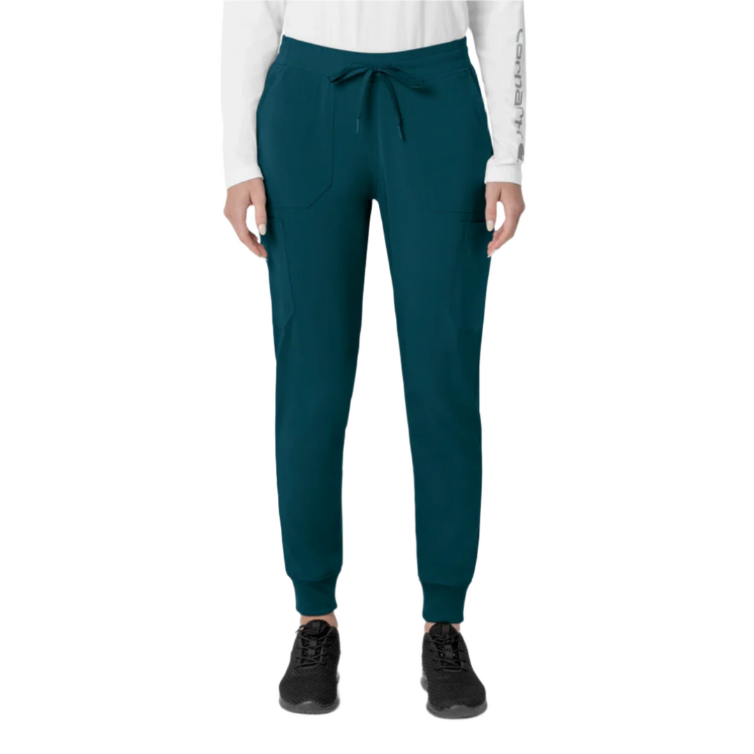 Teal scrub jogger pants with drawstring waist, cargo pockets, and cuffed ankles, shown on a model