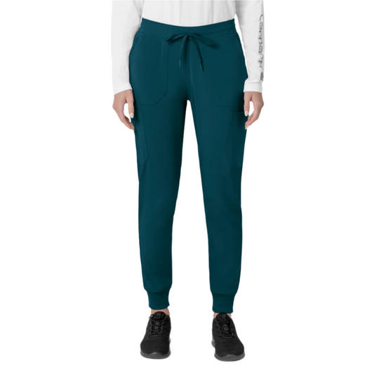 Teal scrub jogger pants with drawstring waist, cargo pockets, and cuffed ankles, shown on a model