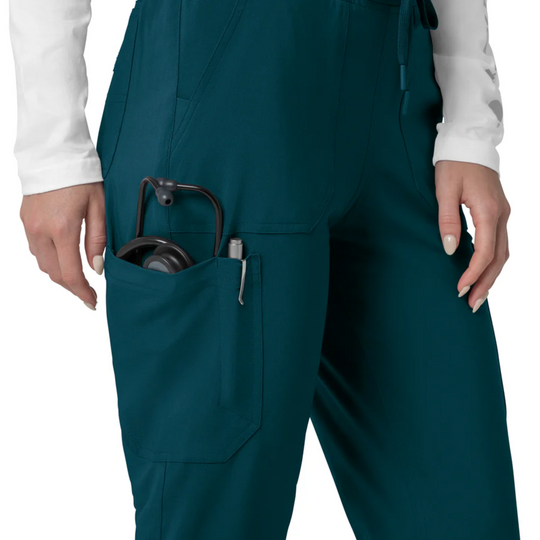 Teal scrub pants with a cargo pocket holding a stethoscope and pen