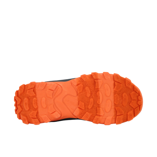 A close-up top-down view of a rugged orange shoe sole with deep lugs and textured tread patterns, shown against a plain white background.