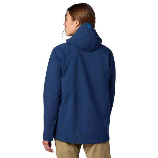 A woman shown from the back wearing a navy blue hooded jacket and tan pants against a plain white background.