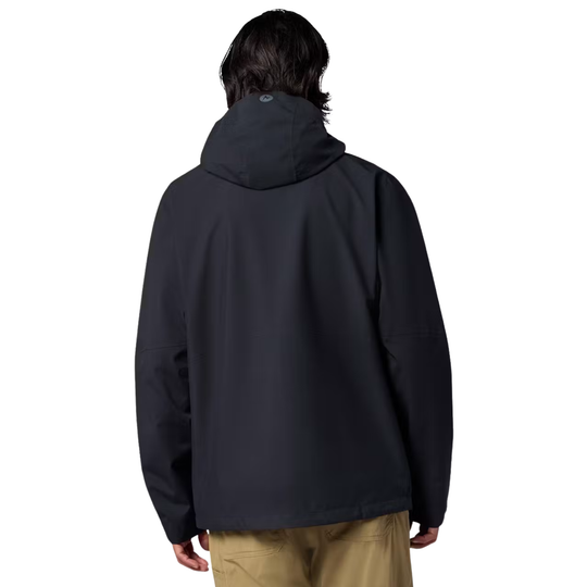 A man viewed from the back wearing a black hooded jacket and tan pants against a plain white background.