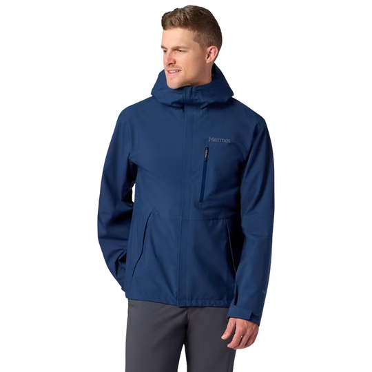 Man wearing a blue jacket with a visible brand logo on a white background