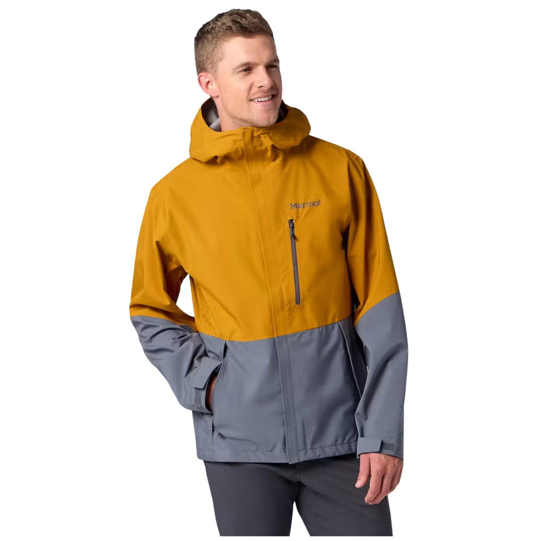 A man wearing a two-tone hooded jacket in mustard yellow and gray, with a vertical front zipper and a small visible 'Marmot' logo on the chest, against a plain white background.