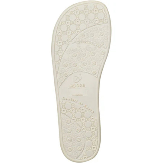 Cream-colored slipper sole with circular tread pattern and ACORN logo.
