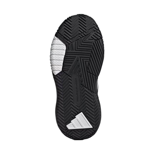 Black rubber sneaker outsole with herringbone tread, white traction inserts, and white Adidas logo detail
