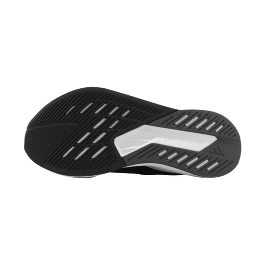 Black and gray athletic shoe outsole with slotted tread and "LIGHTSTRIKE" text