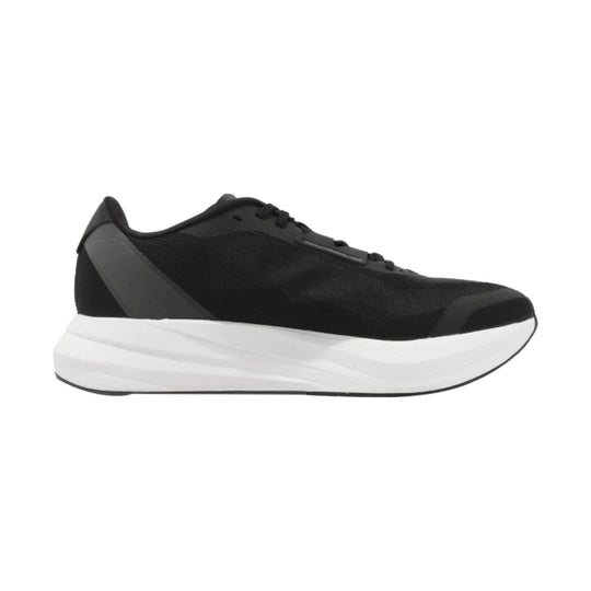 Black athletic sneaker with a thick white foam sole, side profile