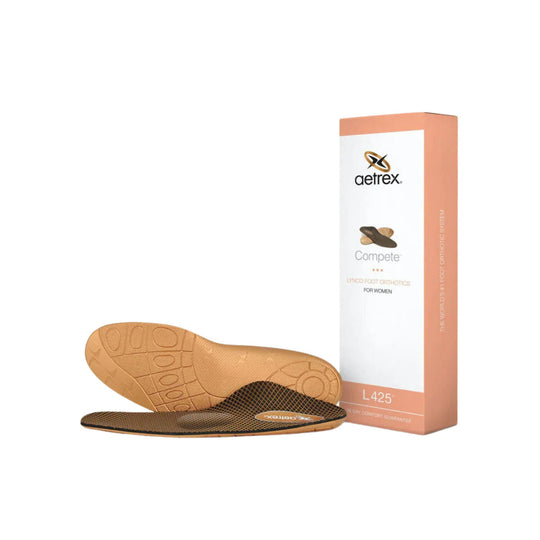 Peach orthotic insoles with a matching Aetrex box and visible tread pattern