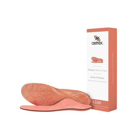 Peach orthotic insoles with aetrex box packaging, shown with one insert standing upright and one lying flat