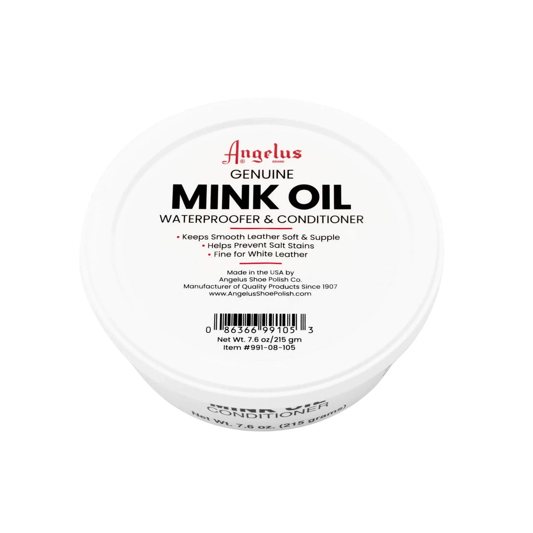 White round tin lid labeled "Mink Oil Waterproofer & Conditioner"