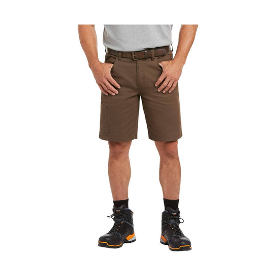 Person wearing brown shorts and black boots on a white background