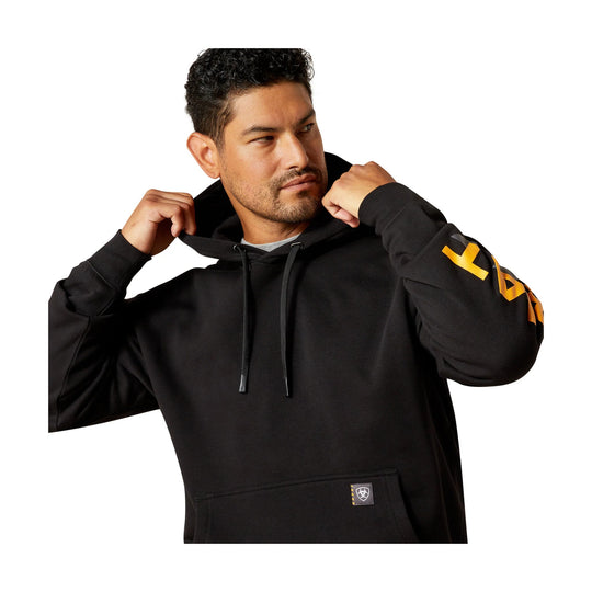 Black pullover hoodie with drawstrings and yellow graphic lettering on the sleeve