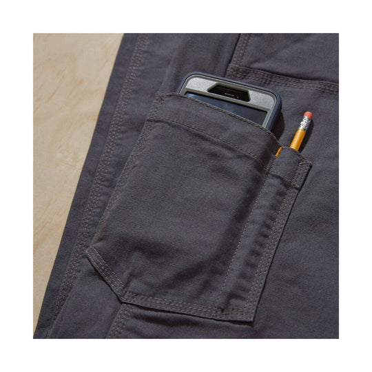 Dark gray work pants pocket with a phone and yellow pencil in cargo pockets
