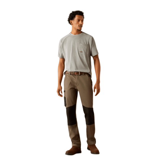 Man wearing gray short-sleeve pocket T-shirt with brown and black work pants and brown boots