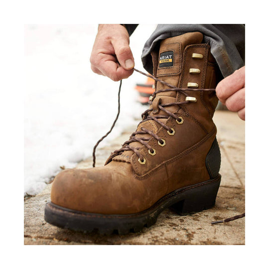Brown leather work boot with lace-up front and padded collar being tied on