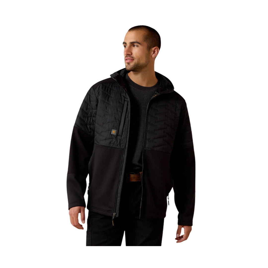 Black quilted zip-front jacket with long sleeves and chest pocket
