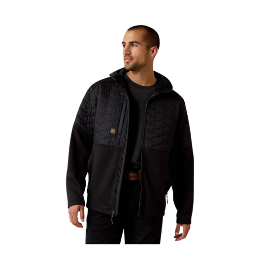 Black quilted zip-front jacket with long sleeves and chest pocket