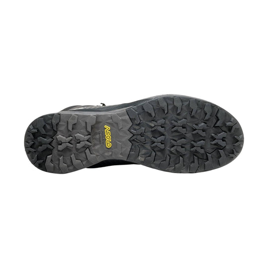 Black hiking boot outsole with aggressive lug tread and yellow Asolo logo