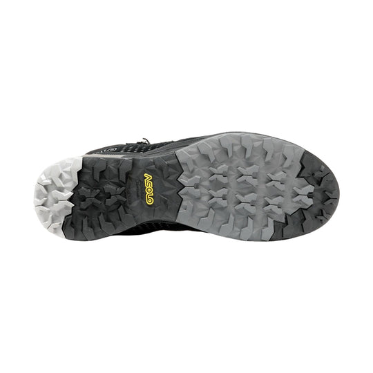 Black hiking boot outsole with gray and white lugs and yellow Vibram branding