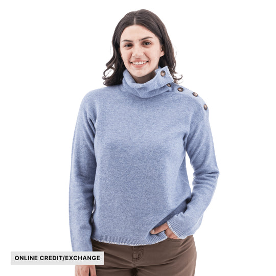 Light blue button-collar sweater with long sleeves and ribbed cuffs, shown on a model