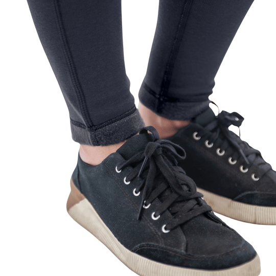 Black fleece-lined leggings with rolled cuffs and black canvas sneakers