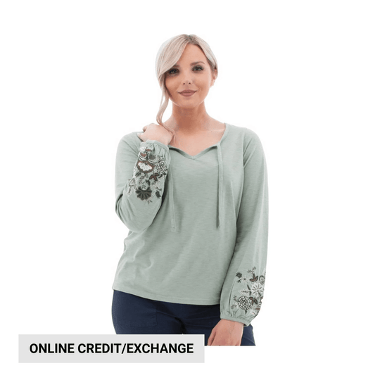 Light sage long-sleeve top with floral embroidered sleeves and a scoop neckline