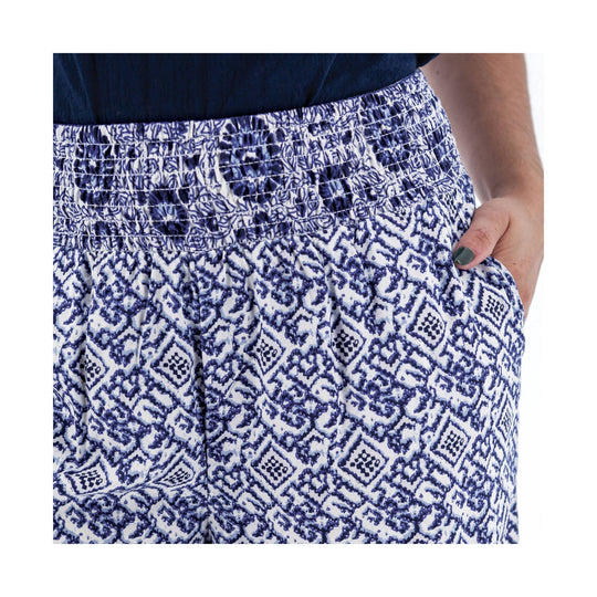 Blue and white patterned wide-leg pants with a smocked elastic waistband and side pockets