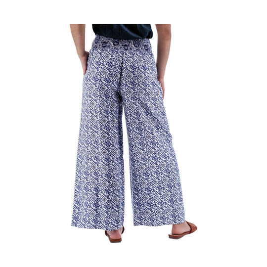 Blue and white patterned wide-leg pants shown from the back