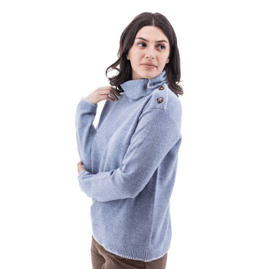 Light blue turtleneck sweater with side button details and long sleeves