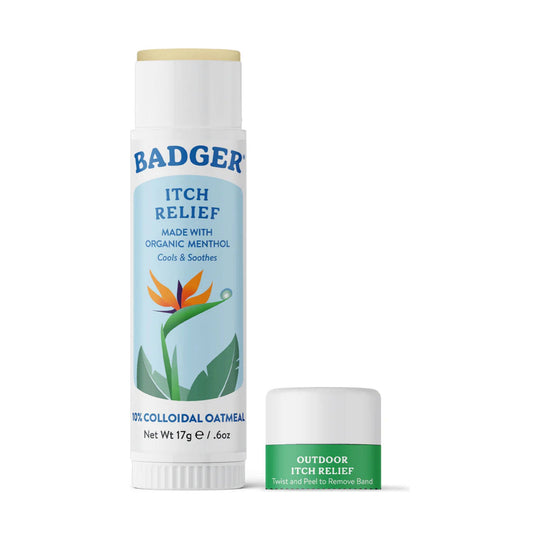 White stick balm tube labeled itch relief with a blue floral graphic, shown with its green cap beside it
