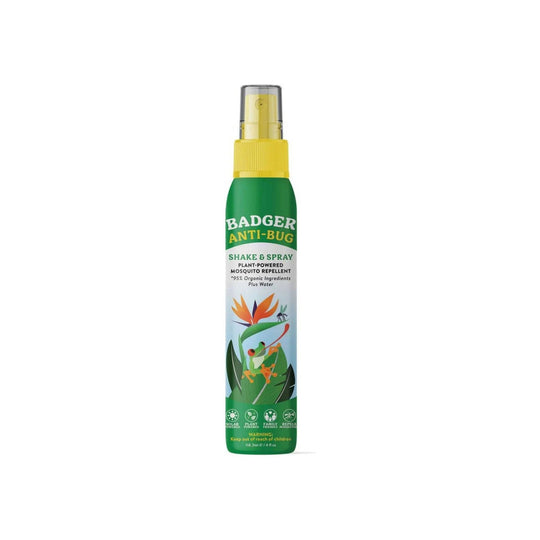 Green and yellow insect repellent spray bottle with a clear cap and plant illustration