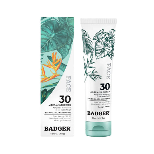 Two white sunscreen tubes with tropical leaf designs and visible SPF 30 text