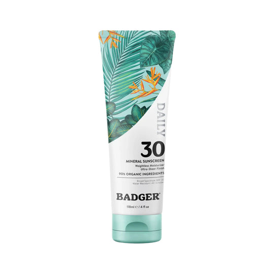 Tube of mineral sunscreen labeled DAILY 30 with tropical leaf design and teal cap