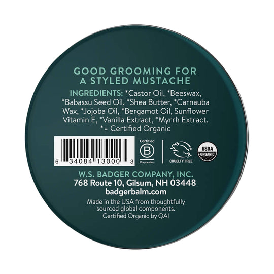 Dark green tin lid for mustache wax with ingredients, barcode, and organic certification marks