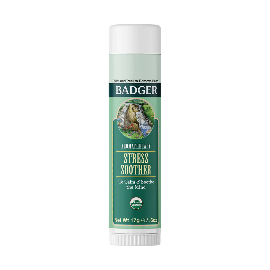 Green aromatherapy balm stick with white cap and woodland label