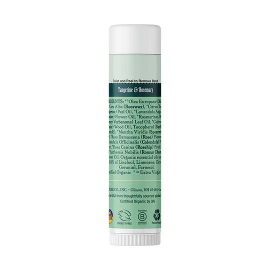 Mint green deodorant stick with white cap and label text including "Tangerine & Rosemary"