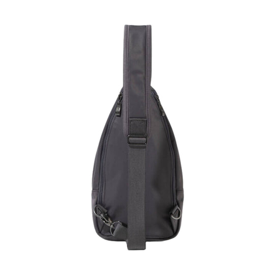 Black sling bag with a top carry handle, adjustable shoulder strap, and side zipper pockets
