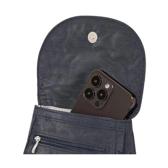 Dark navy crossbody bag with a flap pocket and zippered front pocket, holding a smartphone