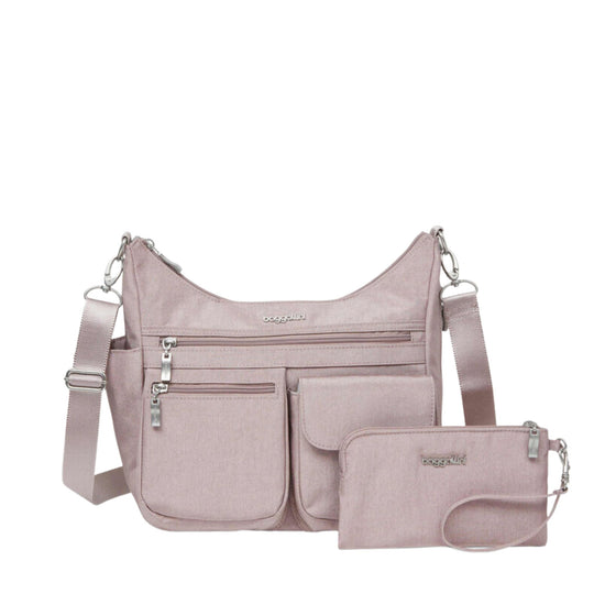 Light pink crossbody bag with multiple front zip pockets and matching zip pouch