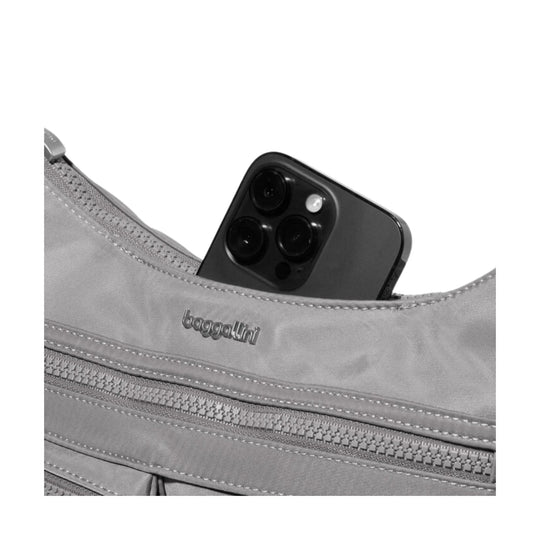 Gray crossbody bag with multiple front zippers, showing a black smartphone partially tucked into the top pocket.