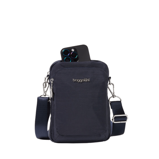 Navy crossbody phone bag with a front zip pocket and adjustable strap